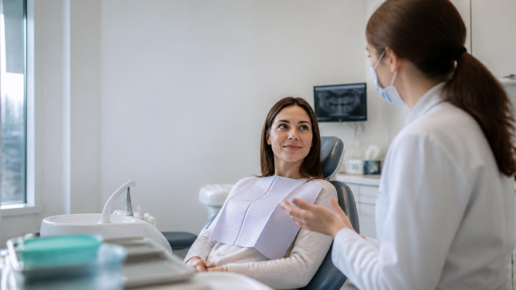 Woman holding her jaw in discomfort, dentist North Andover MA